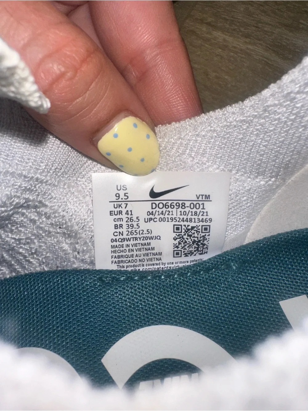 Nike Women’s White Knit Slip-On Sneakers with Teal and Gray Accents